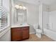 Bathroom featuring a vanity with dark wood cabinetry and a combined tub and shower at 5740 Zelkova Dr, Cumming, GA 30040