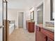 Spacious bathroom featuring double sink vanity, soaking tub, and glass shower with beautiful tile work at 5740 Zelkova Dr, Cumming, GA 30040