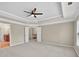 Bedroom with neutral walls and carpet with many doorways and windows at 5740 Zelkova Dr, Cumming, GA 30040