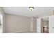 Bright bedroom with carpet, neutral walls, ceiling fan and open doorway at 5740 Zelkova Dr, Cumming, GA 30040