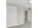 Neutral bedroom featuring a door to the hall, closet, and overhead lighting at 5740 Zelkova Dr, Cumming, GA 30040