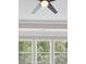 Ceiling fan and bright windows in a room looking out into nature at 5740 Zelkova Dr, Cumming, GA 30040