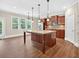 Bright kitchen with a large island, stainless steel appliances, and lots of windows for natural light at 5740 Zelkova Dr, Cumming, GA 30040