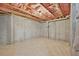Unfinished basement area featuring concrete walls and exposed ceiling with insulation at 5740 Zelkova Dr, Cumming, GA 30040