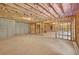 Unfinished basement area with exposed insulation, concrete floor, and visible framing at 5740 Zelkova Dr, Cumming, GA 30040
