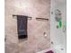 Tastefully designed bathroom boasts marble-like tiling, glass shower door, and sleek towel racks at 1221 Overton Dr, Lawrenceville, GA 30044