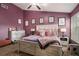This bedroom features a ceiling fan, plush carpet, and plentiful natural light at 1221 Overton Dr, Lawrenceville, GA 30044