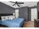 Comfortable bedroom featuring a ceiling fan, plush carpet, and en-suite bathroom at 1221 Overton Dr, Lawrenceville, GA 30044