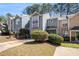Beautiful townhome with a well manicured lawn and driveway at 1221 Overton Dr, Lawrenceville, GA 30044