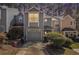 Charming two-story townhome featuring a one-car garage and well-maintained landscaping at 1221 Overton Dr, Lawrenceville, GA 30044