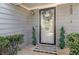 Welcoming front entrance with decorative wreath, stylish mat and lush greenery at 1221 Overton Dr, Lawrenceville, GA 30044