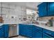 Galley kitchen features stainless appliances and marble countertops at 1221 Overton Dr, Lawrenceville, GA 30044