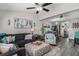 Inviting living room features neutral walls, ceiling fan, and grey wood flooring at 1221 Overton Dr, Lawrenceville, GA 30044