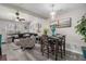 Bright living room featuring high ceilings, large windows, and adjoining dining area at 1221 Overton Dr, Lawrenceville, GA 30044