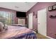 Charming main bedroom with a large bed, window views, and closet at 1221 Overton Dr, Lawrenceville, GA 30044