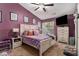 Cozy main bedroom with a large bed, modern furniture and bright light at 1221 Overton Dr, Lawrenceville, GA 30044