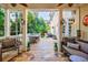 Cozy screened back porch with comfortable seating and a view of the private backyard at 1412 Lanier Ne Mnr, Atlanta, GA 30319