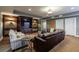 This finished basement has a large entertainment center, comfortable seating, and neutral decor at 1412 Lanier Ne Mnr, Atlanta, GA 30319