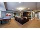 Spacious finished basement features a game table, comfortable seating area, and custom built-ins at 1412 Lanier Ne Mnr, Atlanta, GA 30319