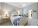 Relaxing bedroom with light blue walls, chandelier, and a cozy bed with a blue throw at 1412 Lanier Ne Mnr, Atlanta, GA 30319