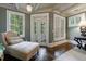 Bedroom sitting area with hardwood floors, natural light, and a chaise lounge at 1412 Lanier Ne Mnr, Atlanta, GA 30319