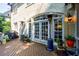 Rear view of a brick home with a charming deck that features multiple heaters for outdoor comfort at 1412 Lanier Ne Mnr, Atlanta, GA 30319