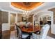 Dining room features a round table, chandelier, and is open to the entry way and living room at 1412 Lanier Ne Mnr, Atlanta, GA 30319