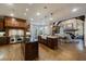Spacious kitchen with wooden cabinets, granite countertops, and large island that opens to the living area at 1412 Lanier Ne Mnr, Atlanta, GA 30319