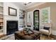 Living room with fireplace, built-in shelves, and neutral decor at 1412 Lanier Ne Mnr, Atlanta, GA 30319