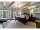 Spacious bedroom with tray ceiling, hardwood floors, and access to a private balcony at 1412 Lanier Ne Mnr, Atlanta, GA 30319