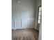 Bright entryway featuring white wainscoting and a door with glass panes, offering a welcoming entrance at 1522 Reserve Glen Dr, Lawrenceville, GA 30043