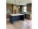 Spacious kitchen featuring an island, shaker cabinets, stone countertops, and stainless sink at 1522 Reserve Glen Dr, Lawrenceville, GA 30043