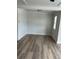 Empty room with wood-look flooring and plenty of natural light at 1522 Reserve Glen Dr, Lawrenceville, GA 30043