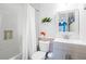 Bathroom featuring white subway tile, a bathtub with a shower, and a sink with vanity at 1602 Buckingham Place Pl, Woodstock, GA 30188