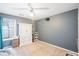 This bedroom features a neutral carpet, a ceiling fan, and a closet with drawers at 1602 Buckingham Place Pl, Woodstock, GA 30188