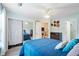 A bright and spacious bedroom features a ceiling fan, closet, and neutral decor for a relaxing retreat at 1602 Buckingham Place Pl, Woodstock, GA 30188