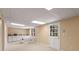 Finished basement featuring a sink, storage cabinets, and easy access to the backyard at 7575 Hunters Woods W Dr, Atlanta, GA 30350
