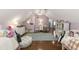Large shared bedroom filled with two beds, a desk, and hardwood floors at 7575 Hunters Woods W Dr, Atlanta, GA 30350