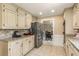 Kitchen features granite counters, tile floors, and stainless steel appliances, and is adjacent to dining at 7575 Hunters Woods W Dr, Atlanta, GA 30350