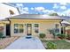 Cozy backyard featuring a small patio, tidy landscaping, and beige siding against a clear blue sky at 1338 Gates Se Dr, Atlanta, GA 30316