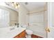 A well-lit bathroom features a shower-tub, toilet, and sink vanity at 1338 Gates Se Dr, Atlanta, GA 30316