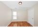 Bedroom with wood-look flooring, white trim, and natural light at 1338 Gates Se Dr, Atlanta, GA 30316