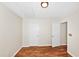 Bedroom with wood-look flooring, white trim, and neutral-tone walls at 1338 Gates Se Dr, Atlanta, GA 30316