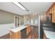 Open kitchen with stainless steel appliances, an island sink, and views into an adjacent dining area at 1338 Gates Se Dr, Atlanta, GA 30316