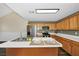 Modern kitchen featuring stainless steel appliances, light wood cabinetry, an island with sink, and ample counter space at 1338 Gates Se Dr, Atlanta, GA 30316