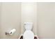 A standard white toilet, neatly placed against a light beige wall at 1338 Gates Se Dr, Atlanta, GA 30316