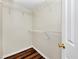 Walk-in closet with wood floors and wire shelving, perfect for storage and organization at 1338 Gates Se Dr, Atlanta, GA 30316