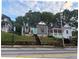 Charming neighborhood street featuring historic homes, lush greenery, and classic architecture needing repairs at 255 Georgia Se Ave, Atlanta, GA 30312