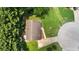Aerial view of a charming home featuring a lush green lawn surrounded by mature trees at 35 Ravenwood Dr, Rockmart, GA 30153