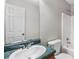 Bathroom featuring a tub, toilet, sink with chrome faucet and large wall mirror at 35 Ravenwood Dr, Rockmart, GA 30153